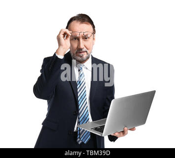 Portrait of handsome mature businessman with laptop on white background Stock Photo