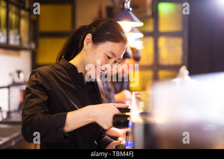 waitress serving in modern cafe Stock Photo