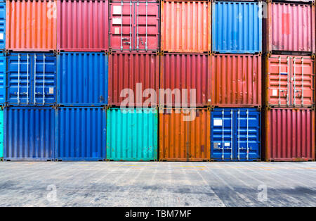 stack of containers with empty road in front Stock Photo