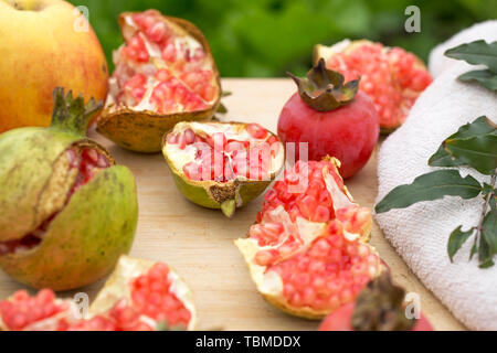 Fresh pomegranates, persimmons and apples, fall specialty fruit Stock Photo