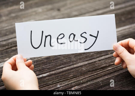 Reynolds card with text on old wood plate Stock Photo