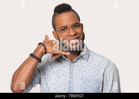 Happy black young man laugh isolated on grey background Stock Photo