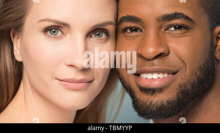 Headshot of happy multiethnic couple posing in studio Stock Photo