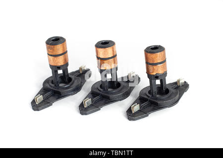 Alternator slip rings on isolated white background. Auto electrical parts. Stock Photo
