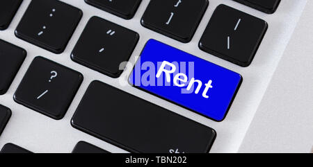 Text Rent on blue computer keypad button Stock Photo