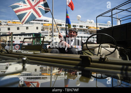Veteran John Roberts, 95, from Whitstable, on a jeep as he arrives to the cruise termianl to board the MV Boudicca (behind) ahead of its departure from the port of Dover in Kent, on day one of a trip arranged by the Royal British Legion for D-Day veterans to mark the 75th anniversary of D-Day. Stock Photo