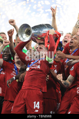 Liverpool captain Jordan Henderson lifts the trophy after the final whistleduring the UEFA Champions League Final at the Estadio Metropolitano, Madrid Stock Photo