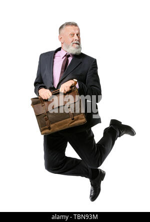 Jumping mature man with briefcase on white background Stock Photo