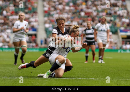 England Women's Sarah McKenna and Barbarians Women's Jasmine Joyce during the Women's International match at Twickenham Stadium, London. Stock Photo