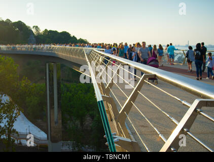 Crowd of people at new Pedestrian-Bicycle Bridge at sunset. Focus in the foreground, Kiev, Ukraine Stock Photo