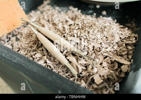 pottery tools for carving ceramic products in workshop Stock Photo