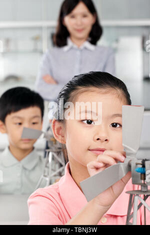 Students in physics class spin Newton's colorful wheel Stock Photo - Alamy