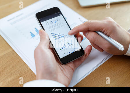 businessman checking financial reports on table Stock Photo