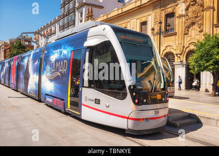 Seville, Spain - May 20, 2019:  A modern comfortable tram on the city street. Seville. Andalusia Spain . Stock Photo