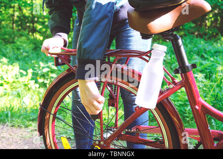 Preparing the bike for the long road. Compact packing of travel bag. Bike on the road Stock Photo