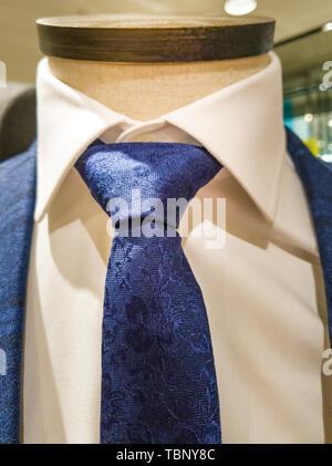 Latest trends in Suit, shirt and tie combination - Navy suit and tie - white shirt Stock Photo