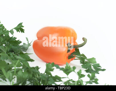 sweet pepper and sprigs of parsley isolated on white background.photo with copy space Stock Photo