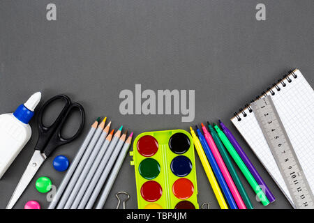 different school stationery. set on a black background. space for text Stock Photo