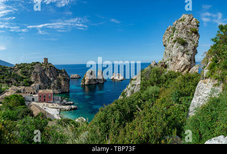 Scenic coastline with rocks and deep blue sea near Castellamare del Golfo by entrance to natural reserve Zingaro, Sicily, Italy Stock Photo
