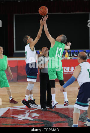 Beijing, China's Sichuan Province. 1st June, 2019. Hong Qingfu (2nd R), a 76-year-old basketball player from Hong Kong, south China and Liu Zihua, a 79-year-old basketball player from Indonesia jump for the ball during the elderly group competition of Beijing Basketball Game for Chinese of the World in Dujiangyan, southwest China's Sichuan Province, June 1, 2019. Credit: Meng Yongmin/Xinhua/Alamy Live News Stock Photo