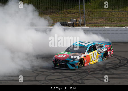 Long Pond, Pennsylvania, USA. 2nd June, 2019. June 02, 2019: Kyle Busch (#18) celebrates with a smokeshow after winning the Monster Energy NASCAR Cup Series Pocono 400 at Pocono Raceway in Long Pond, PA Daniel Lea/CSM Stock Photo