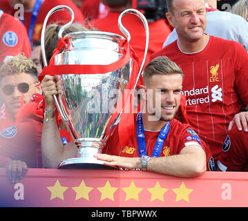 2nd June 2019, Liverpool, Merseyside; Liverpool FC celebration parade after their Champions League final win over Tottenham Hotspur in Madrid on 1st June; Liverpool captain Jordan Henderson poses with the trophy at the front of the team bus Stock Photo