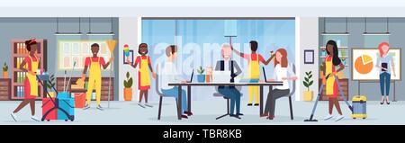janitors team african amerian cleaners in uniform working together with professional equipment cleaning service concept creative co-working center Stock Vector
