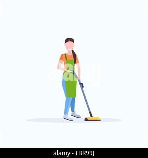 woman in apron using vacuum cleaner female janitor cleaning service ...
