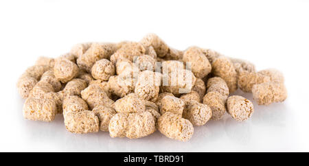 extruded wheat bran pellets isolated on white Stock Photo