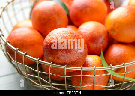 Fresh blood oranges in basket, closeup Stock Photo