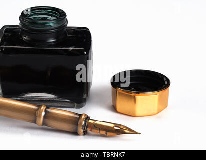 old inkwell and quill on white background Stock Photo
