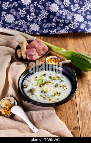 Leather egg lean meat porridge porridge breakfast wooden table food photography picture Stock Photo