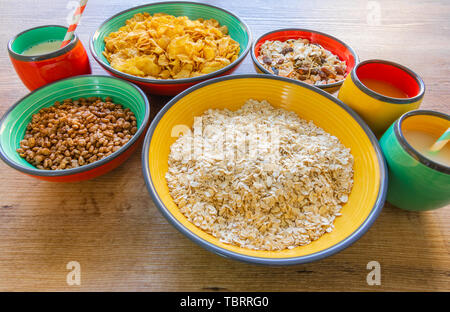 Different types of cereals served in ceramic bowls - Top view Stock Photo