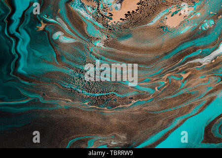 Fluid Art. Abstract marble background or texture. Turquoise waves andbronze spots inclusions. Stock Photo