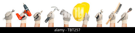 Hand tools. Hands holding construction tools isolated on white background. Stock Photo