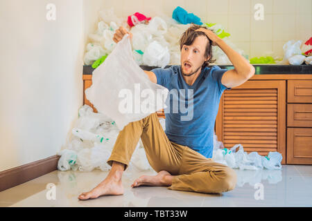 The man used too many plastic bags that they filled up the entire kitchen. Zero waste concept. The concept of World Environment Day Stock Photo