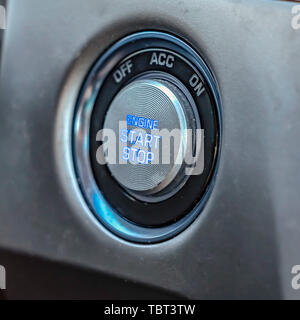 Square Close up view of an engine push start and stop button inside a vehicle Stock Photo