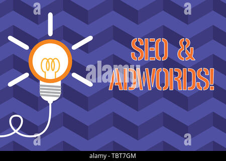 Text sign showing Seo And Adwords. Business photo text they are main tools components of Search Engine Marketing Big idea light bulb. Successful turni Stock Photo