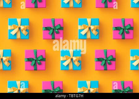 Multiple gift boxes organized over yellow background, top view Stock Photo