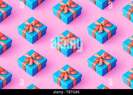 Multiple blue gift boxes organized over pink background, top view Stock Photo