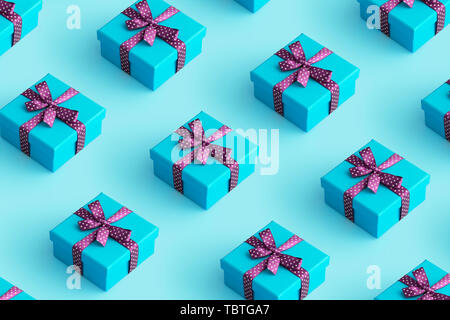 Multiple blue gift boxes organized over blue background, top view Stock Photo