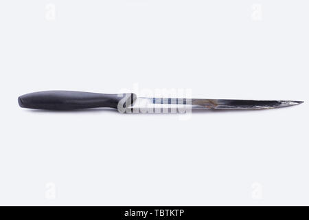 Rusty old knife with black rubber handle. Used knife isolated on white background. Space for text. Stock Photo