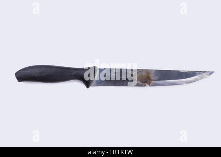Rusty old knife with rubber handle. Antique handle knife isolated on white background. Stock Photo