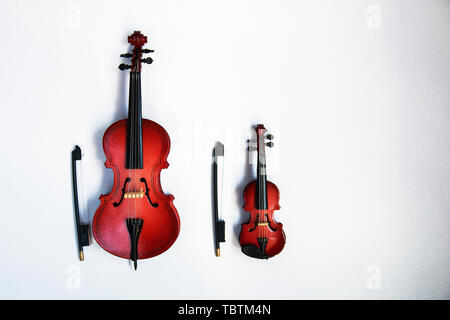 classic stringed instruments cello and violin isolated on white background. Stock Photo