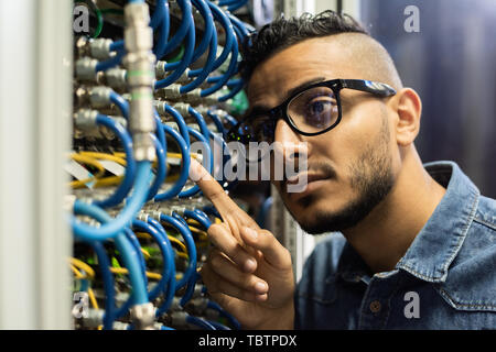 Maintenance engineer examining database server  Stock Photo