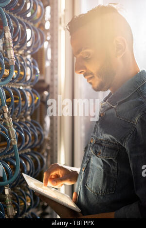 Serious IT engineer viewing test results Stock Photo