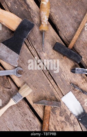 Set of various tools and instruments, top view. Top view of used tools on rustic wooden boards. Space for text. Stock Photo