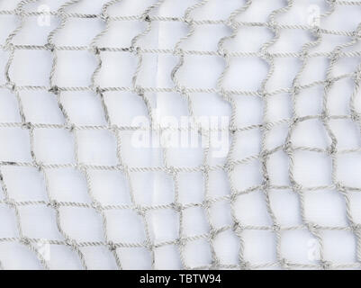 A rope mesh on a white substrate background template Stock Photo