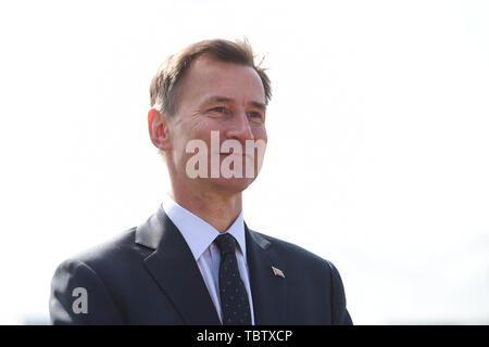 Foreign Secretary Jeremy Hunt speaks to the media following the arrival of US President Donald Trump and his wife Melania at Stansted Airport in Essex, for the start of his three day state visit to the UK. Stock Photo