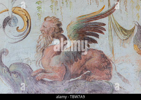 Langhirano, Italy: June 2, 2019: detail of a fresco on the walls of torrechiara castle in Parma, representing a chimera Stock Photo